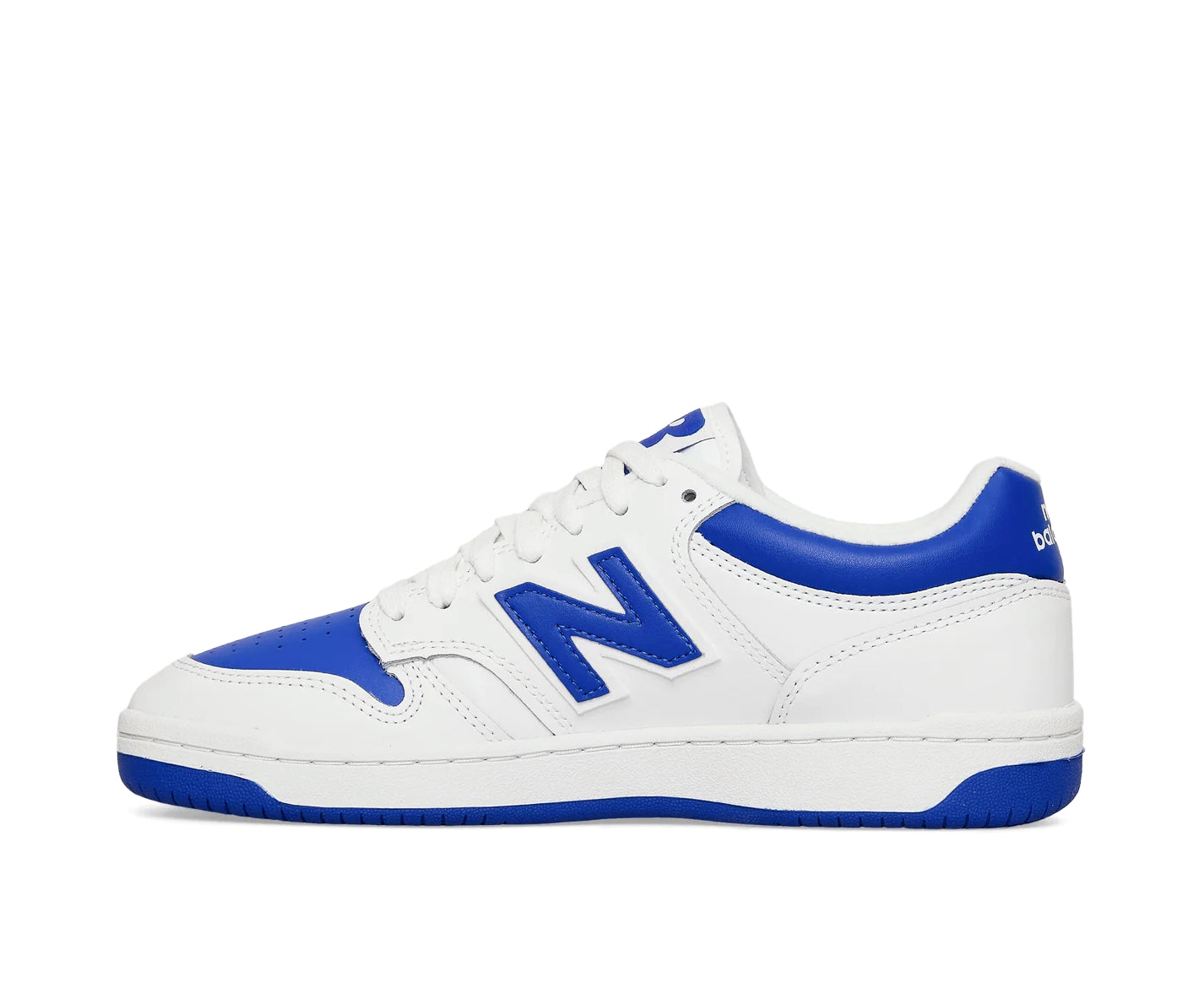 A white leather New Balance basketball shoe with cobalt blue accents.