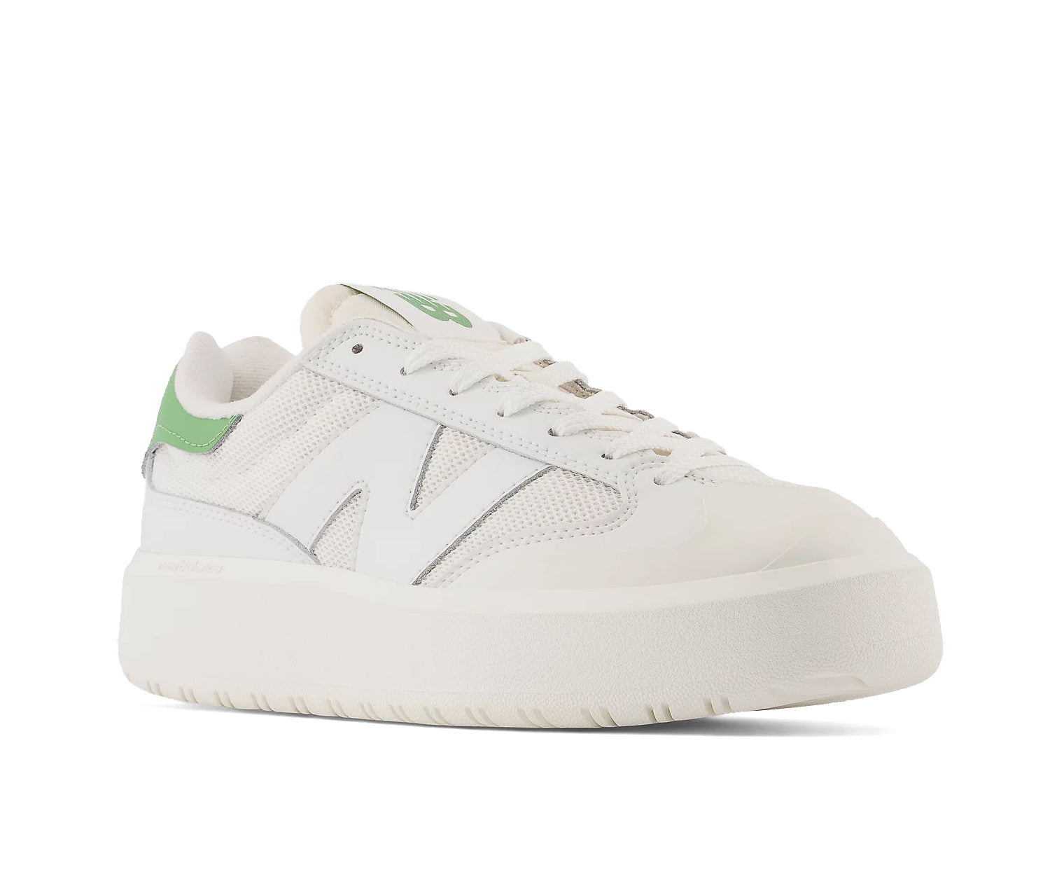 An off-white mixed canvas and leather platform sneaker with green accents from New Balance.An off-white mixed canvas and leather platform sneaker with green accents from New Balance.